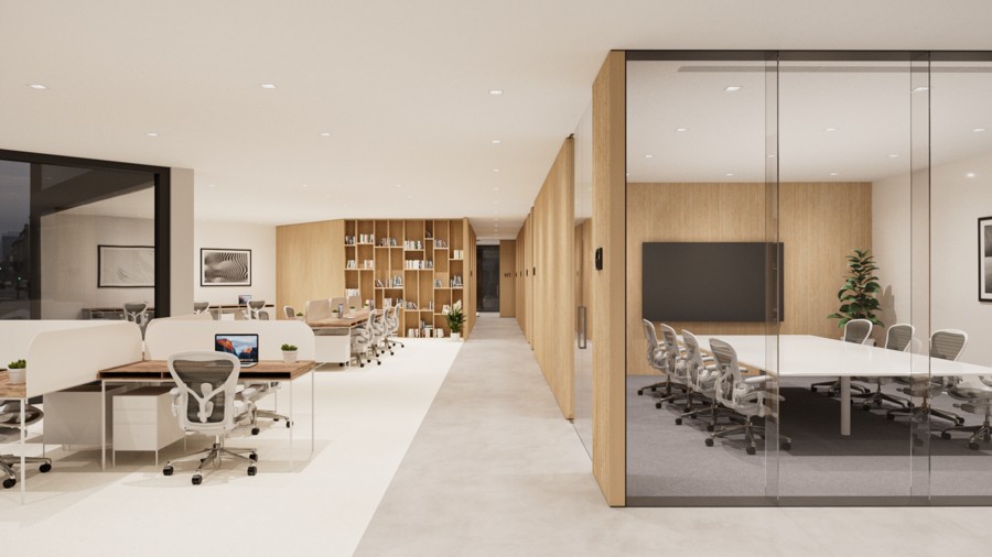 A warmly lit open-concept office with conference rooms.